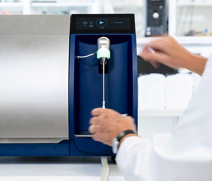 Laboratory employee using Milkoscan FT3